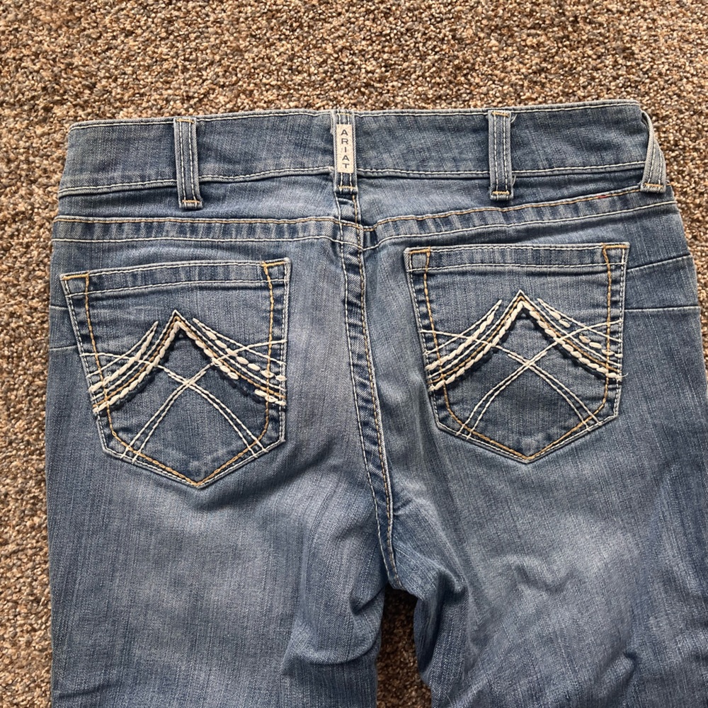 Light was Ariat jeans
